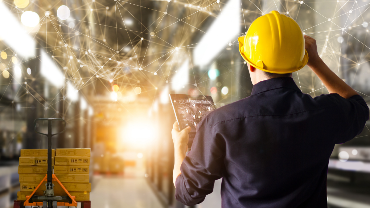 warehouse worker checking phone shift plan