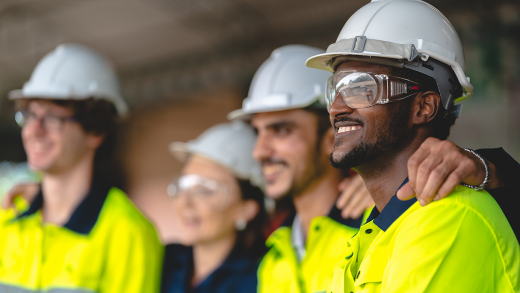 warehouse workers standing together as a team